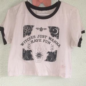 witch white and dark brown/ black t shirt